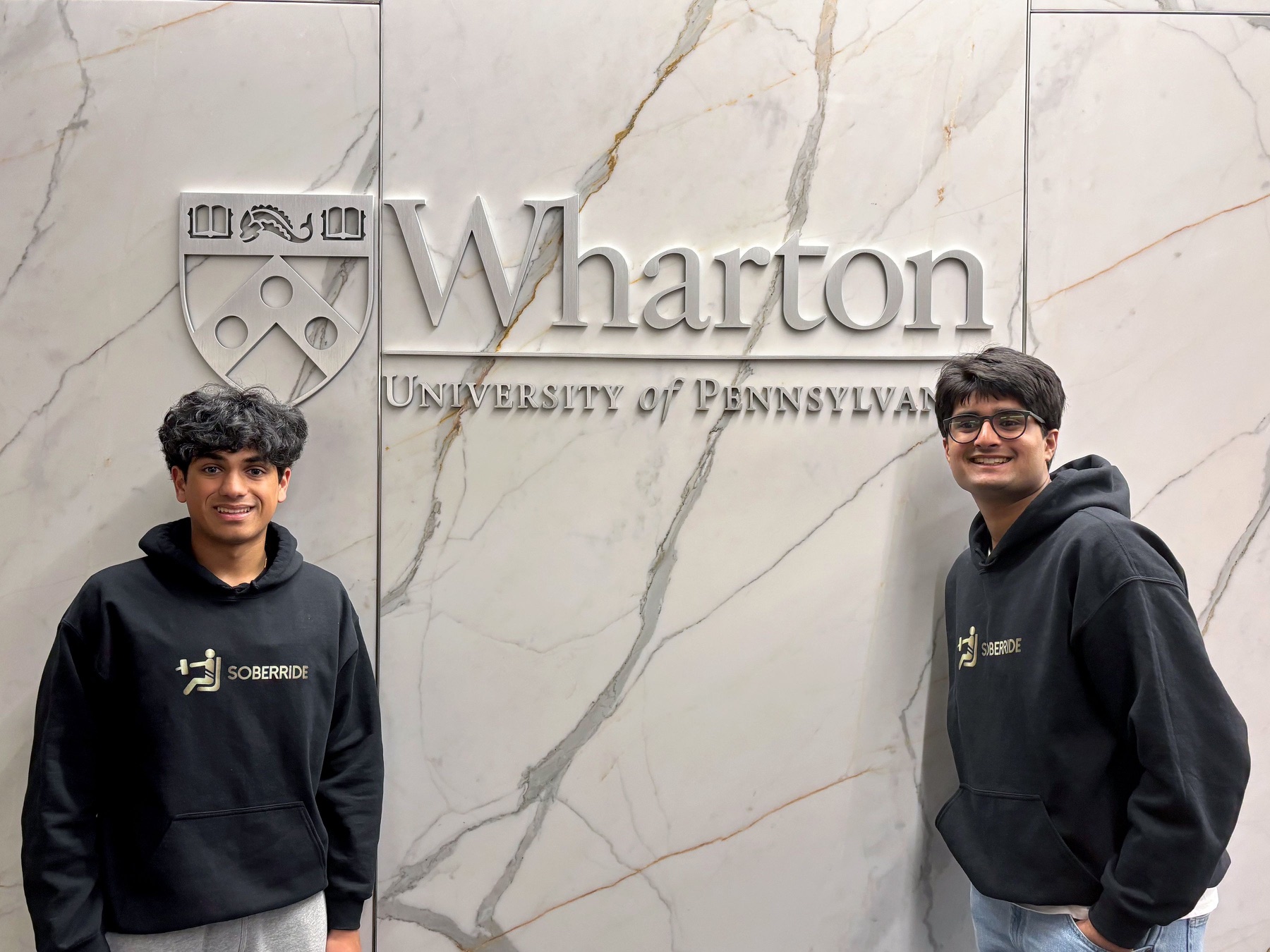 Swayam Shah and Shaurya Mantrala in SoberRide hoodies at the Wharton wall letters